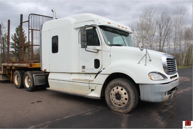 Freightliner Log Truck with a Fruehauf Dropdeck Trailer Minnesota